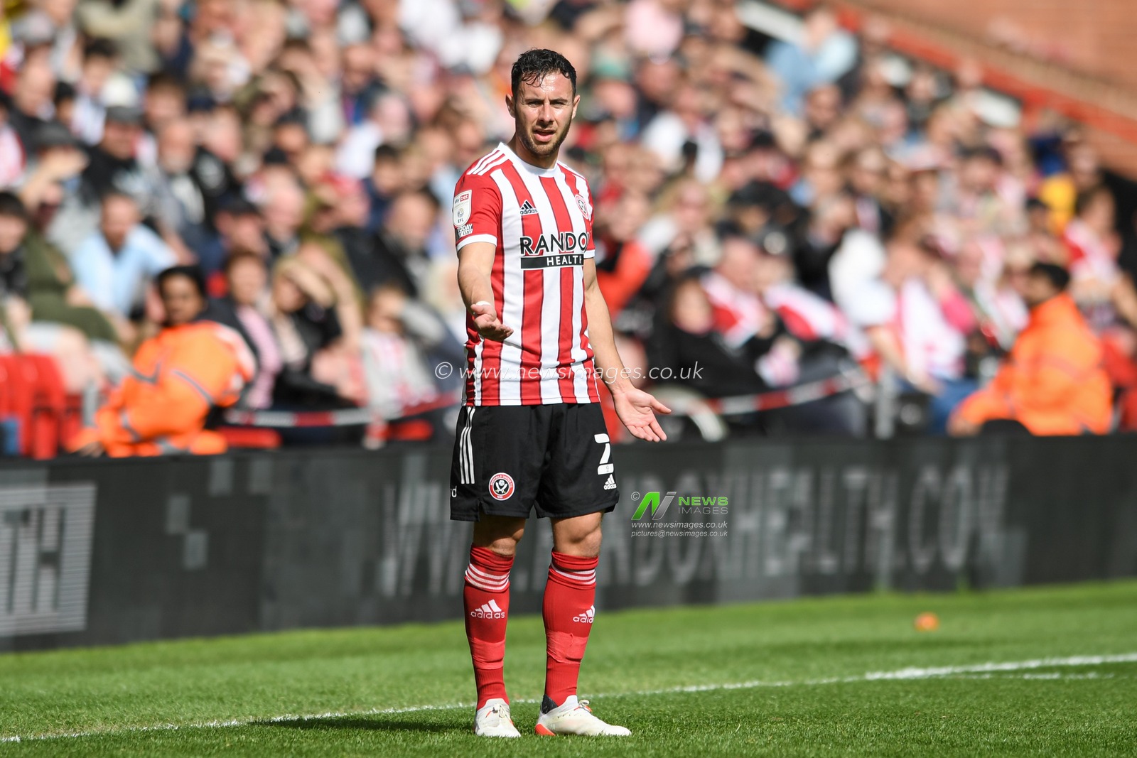 George Baldock #2 of Sheffield United shows frustration with a misplaced pass