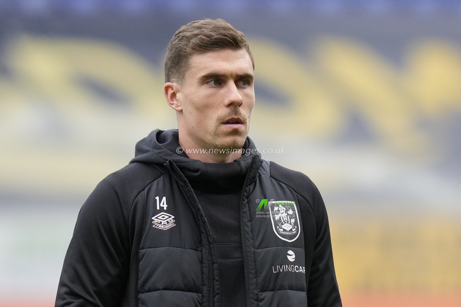 Josh Ruffels #14 of Huddersfield Town inspects the pitch before the Sky Bet Championship match Wigan Athletic vs Huddersfield Town at DW Stadium, Wigan, United Kingdom, 11th February 2023

(Photo by Steve Flynn/News Images)