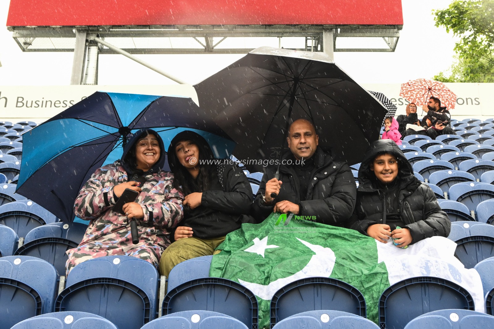 Fans umbrellas are up as rain starts to fall at Sophia Gardens Cricket Ground ahead of the Vitality T20 International Series match England vs Pakistan at Sophia Gardens Cricket Ground, Cardiff, United Kingdom, 28th May 2024

(Photo by Craig Thomas/News Images)