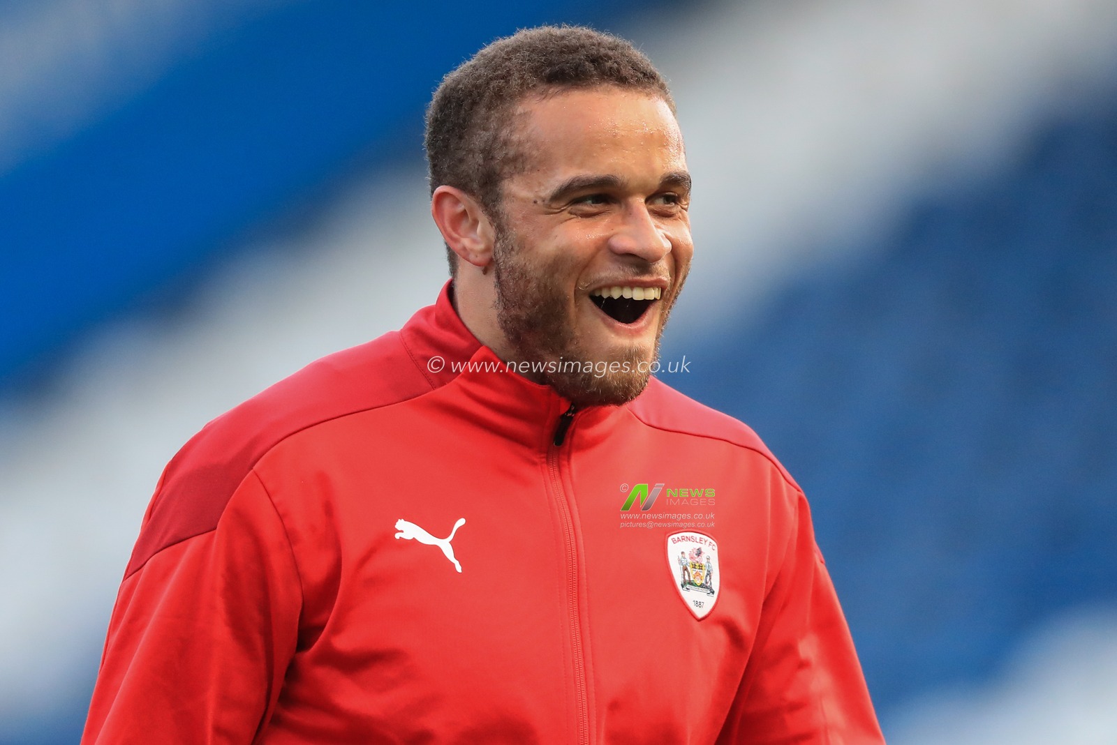 Carlton Morris #14 of Barnsley full of smiles during the pre-game warmup