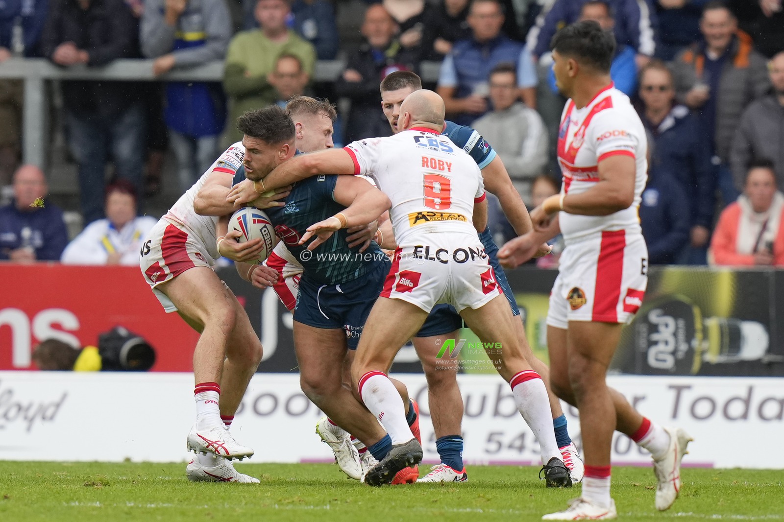 James Roby #9 of St. Helens tackles Joe Philbin #15 of Warrington Wolves high during the Betfred Super League Eliminator match St Helens vs Warrington Wolves at Totally Wicked Stadium, St Helens, United Kingdom, 30th September 2023

(Photo by Steve Flynn/News Images)