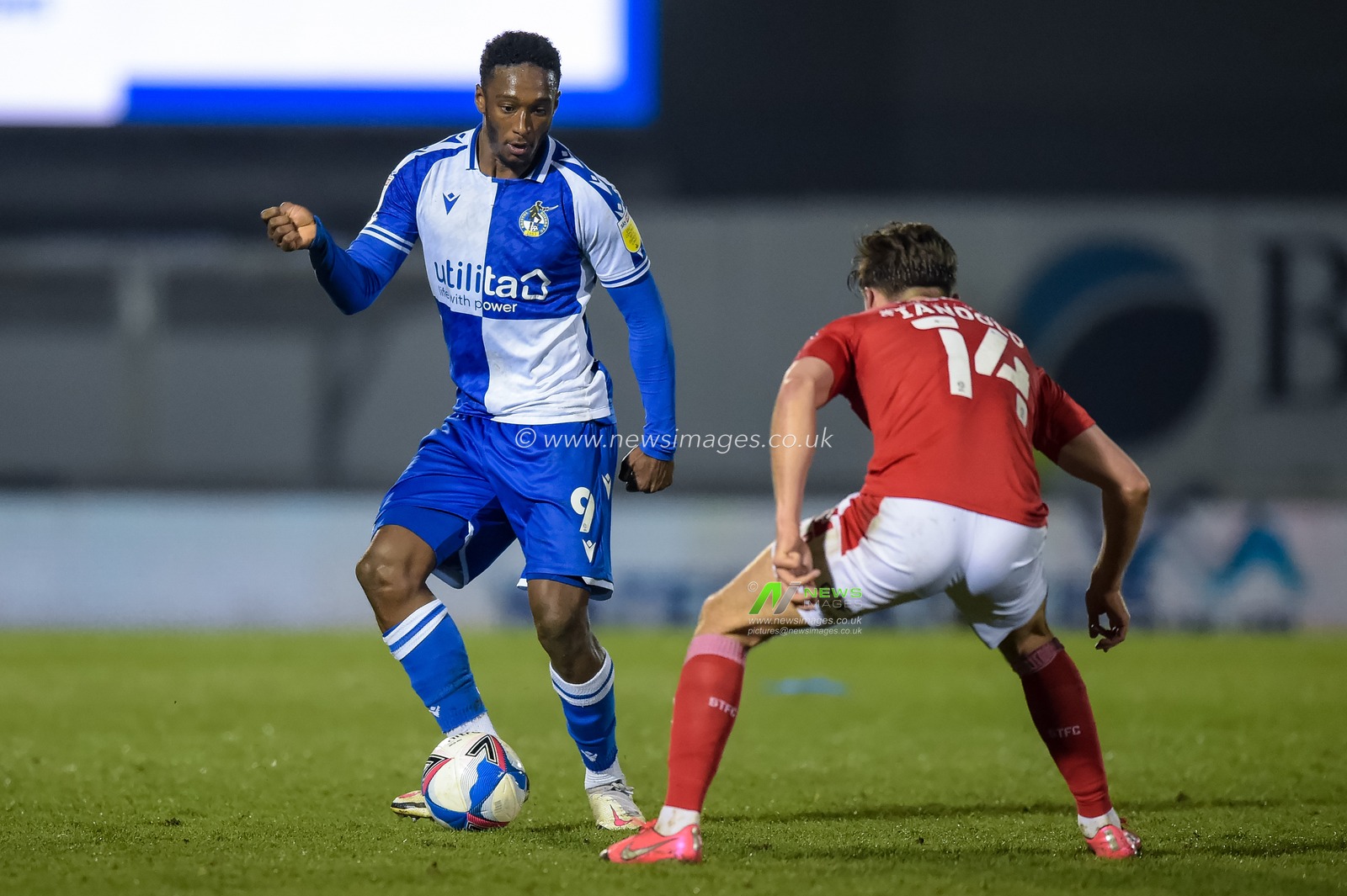 Brandon Hanlan #9 of Bristol Rovers looks to take on Ellis Iandolo #14 of Swindon Town