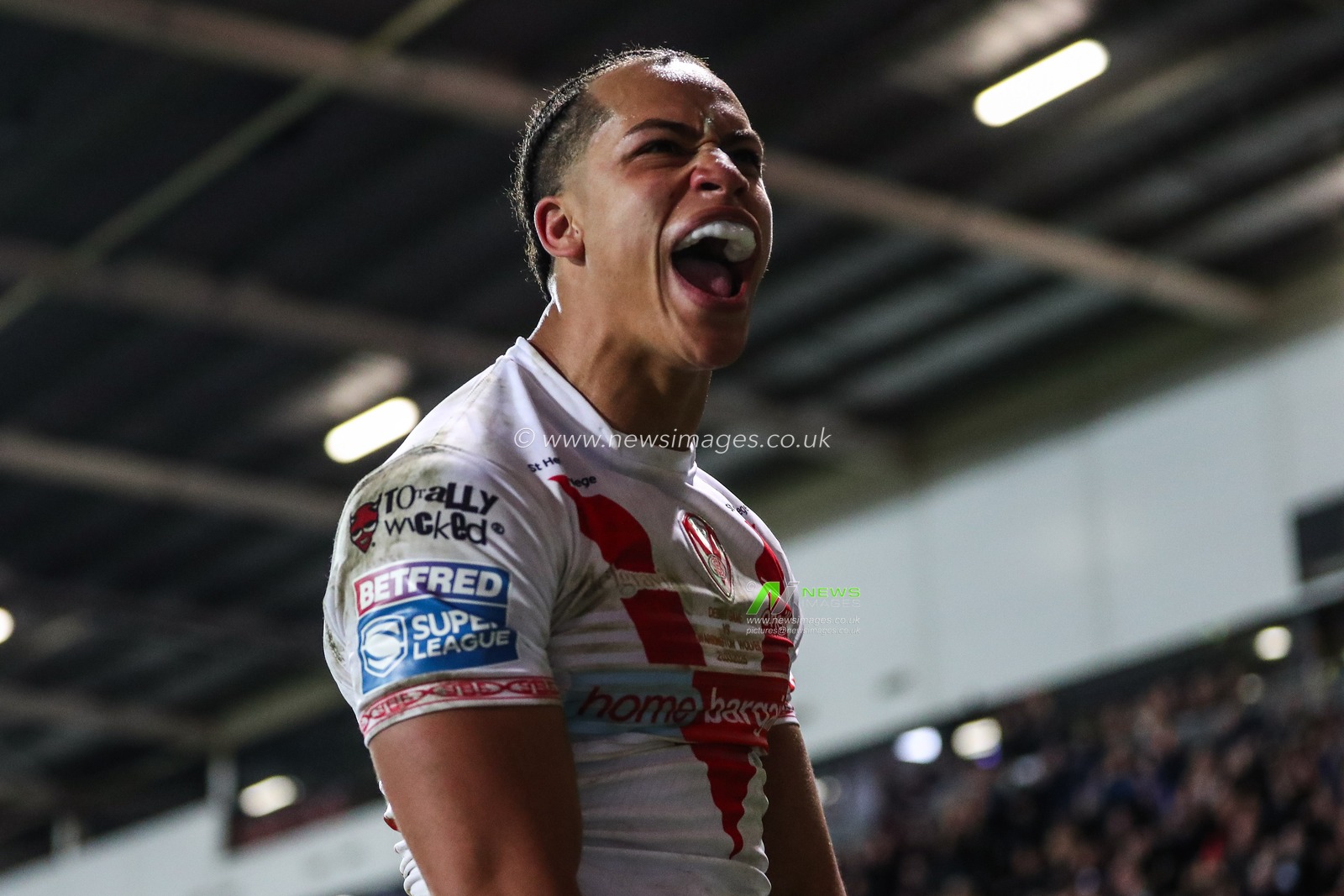 Dayon Sambou of St. Helens celebrates his try to make it 12-14 during the Betfred Super League Round 5 match St Helens vs Warrington Wolves at Totally Wicked Stadium, St Helens, United Kingdom, 21st March 2025

(Photo by Gareth Evans/News Images)