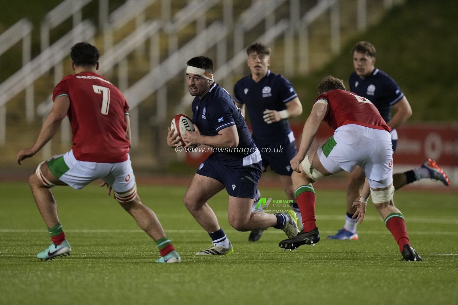 Jerry Blyth-Lafferty of Scotland U20's runs at Lucas de la Rua of Wales U20's during the 2024 Guinness U20 Six Nations match Wales U20s vs Scotland U20s at Stadiwm CSM, Colwyn Bay, United Kingdom, 2nd February 2024

(Photo by Steve Flynn/News Images)