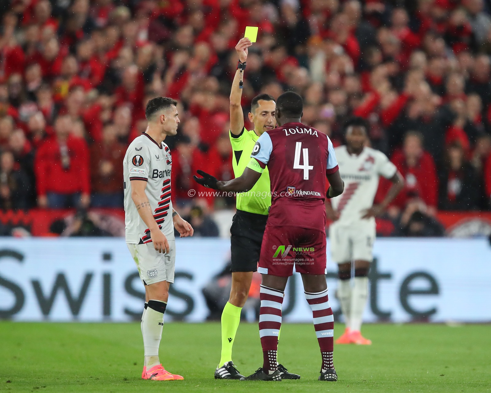 Kurt Zouma of West Ham United receives a yellow card from referee Jose Maria Sanchez Martinez, during the UEFA Europa League Quarter-Final match West Ham United vs Bayer 04 Leverkusen at London Stadium, London, United Kingdom, 18th April 2024

(Photo by Gareth Evans/News Images)