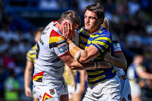 Liam Byrne of Warrington Wolves is tackled by Will Gardiner of Bradford Bulls and Mitch Souter of Bradford Bulls during the Betfred Super League round 12 match Warrington Wolves vs Bradford Bulls at The Halliwell Jones Stadium, Warrington, United Kingdom on 24 May 2026

(Photo by Alfie Cosgrove/News Images)