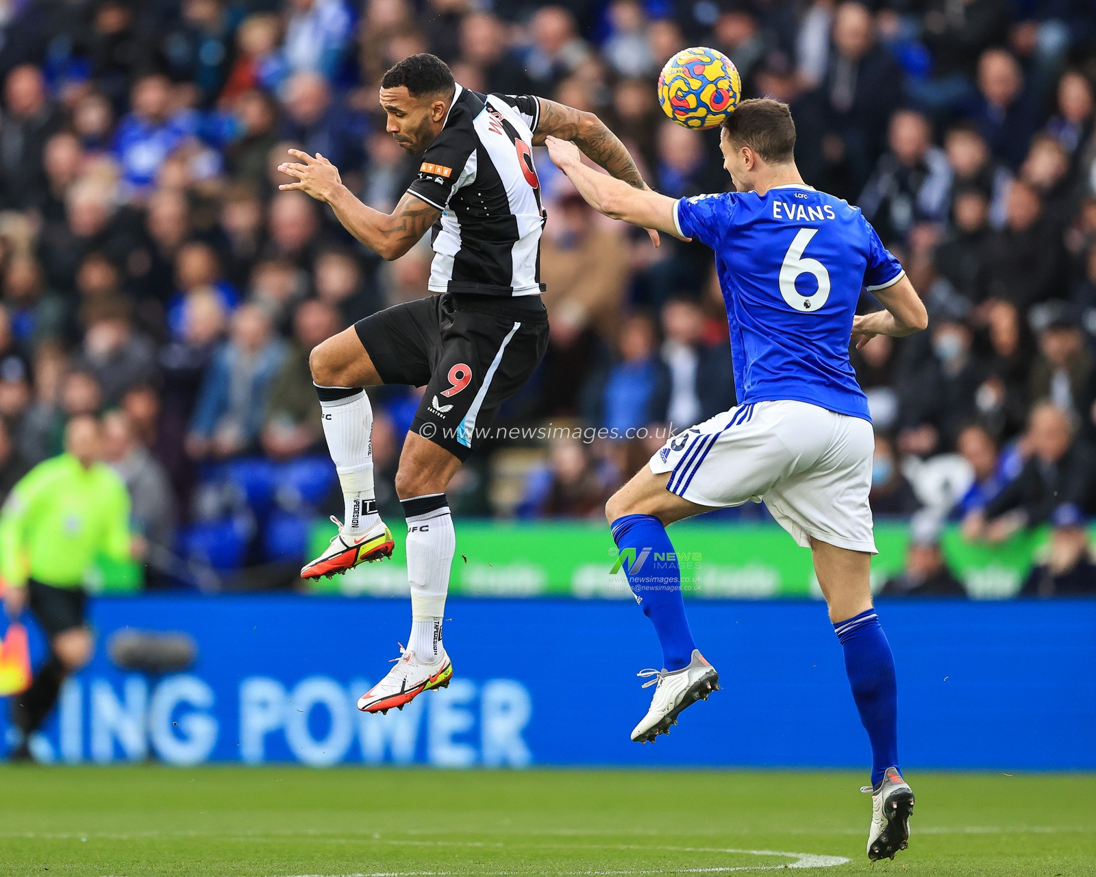 Jonny Evans #6 of Leicester City wins the header from Callum Wilson #9 of Newcastle United