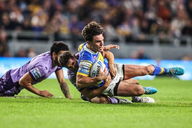 Brodie Croft of Leeds Rhinos is tackled by Tyrone May of Hull KR during the Betfred Super League round 23 match Leeds Rhinos vs Hull KR at Headingley Stadium, Leeds, United Kingdom, 21st August 2025

(Photo by Alfie Cosgrove/News Images)