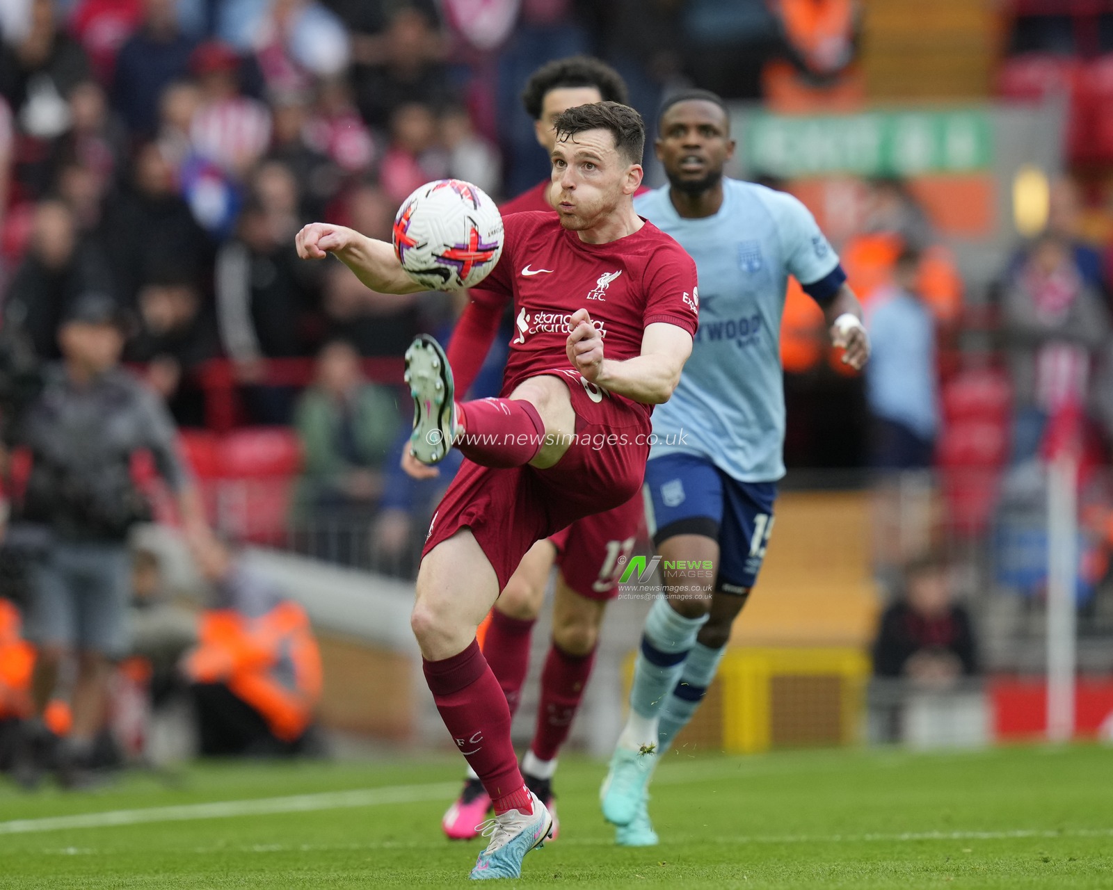 Andrew Robertson #26 of Liverpool clears the ball during the Premier League match Liverpool vs Brentford at Anfield, Liverpool, United Kingdom, 6th May 2023

(Photo by Steve Flynn/News Images)