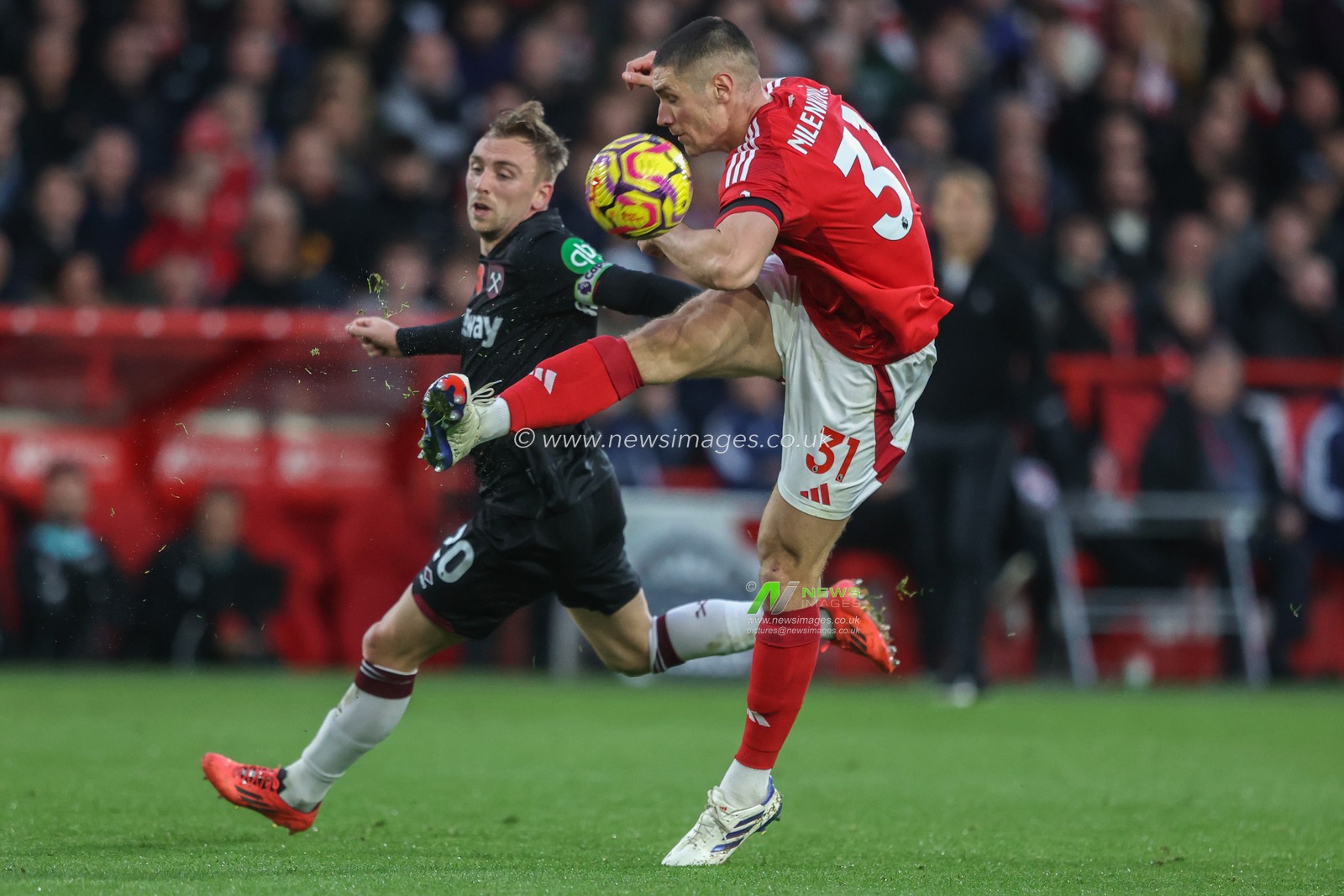 Nikola MilenkoviÄ‡ of Nottingham Forest clears the ball under pressure from Jarrod Bowen of West Ham during the Premier League match Nottingham Forest vs West Ham United at City Ground, Nottingham, United Kingdom, 2nd November 2024

(Photo by Alfie Cosgrove/News Images)