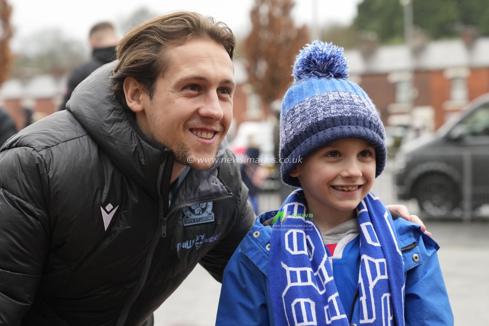 Callum Brittain #2 of Blackburn Rovers poses for a photo with a fan before the Sky Bet Championship match Blackburn Rovers vs Leeds United at Ewood Park, Blackburn, United Kingdom, 9th December 2023

(Photo by Steve Flynn/News Images)