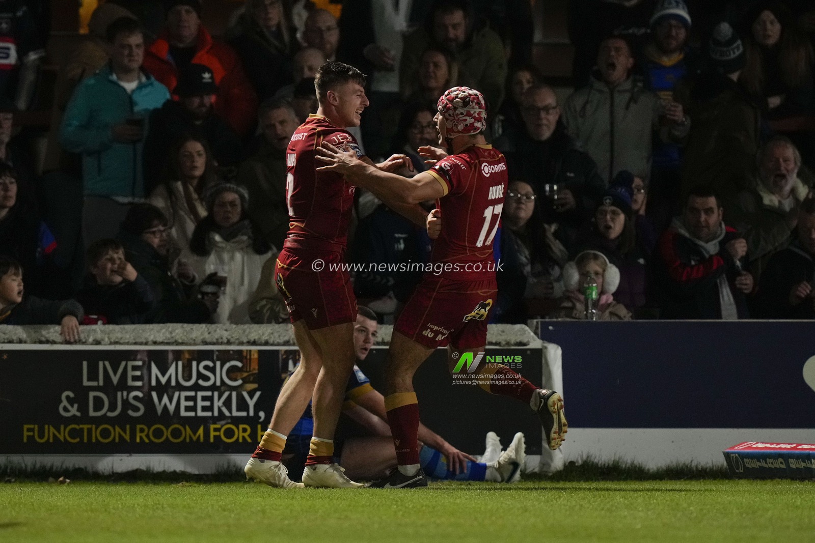 Tom Davies #2 of Catalans Dragons celebrates scoring a try during the Betfred Super League  Round 1 match Wakefield Trinity vs Catalans Dragons at The Be Well Support Stadium, Wakefield, United Kingdom, 17th February 2023

(Photo by Steve Flynn/News Images)