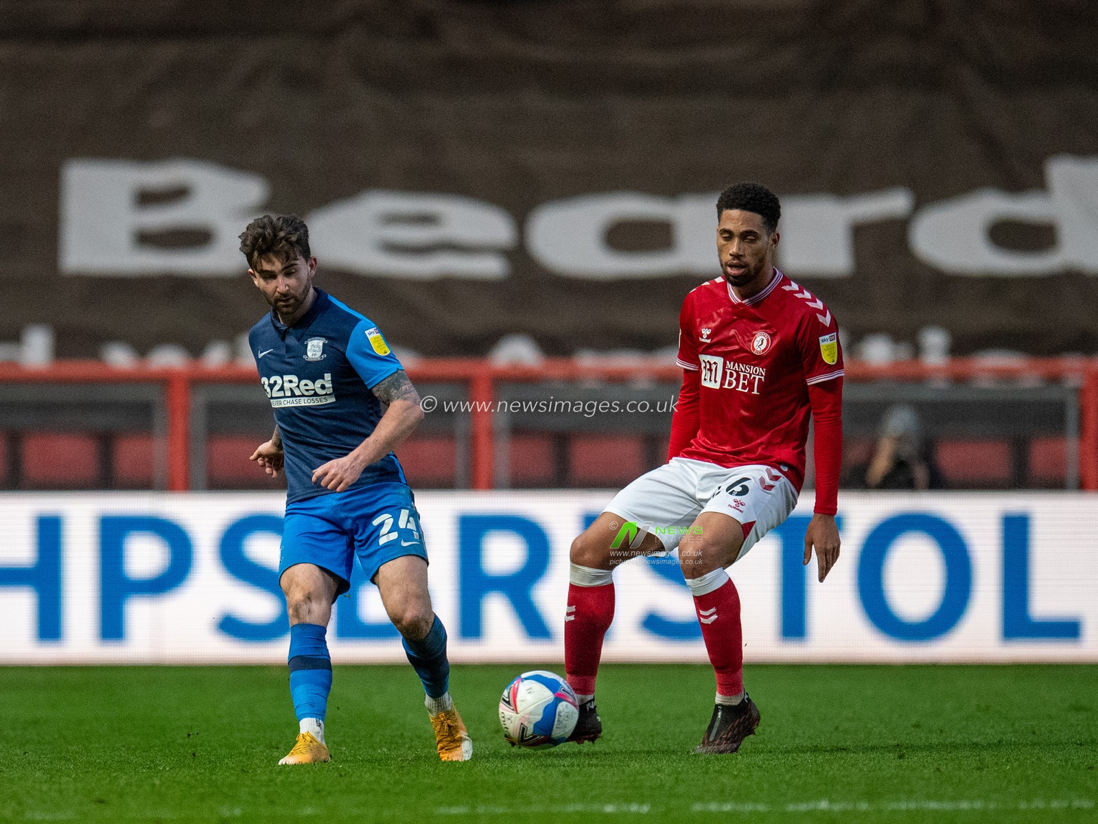 Sean Maguire #24 of Preston North End passes the ball under pressure from Zak Vyner #26 of Bristol City