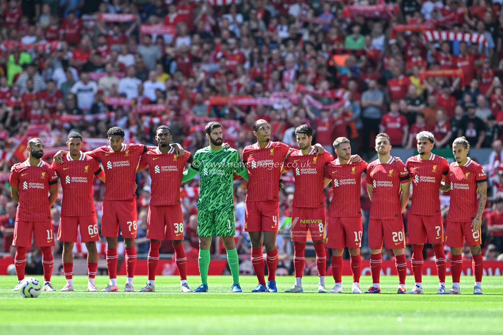 Liverpool squad pauses for a minutes silence ahead of  the Pre-season friendly match Liverpool vs Sevilla at Anfield, Liverpool, United Kingdom, 11th August 2024

(Photo by Cody Froggatt/News Images)