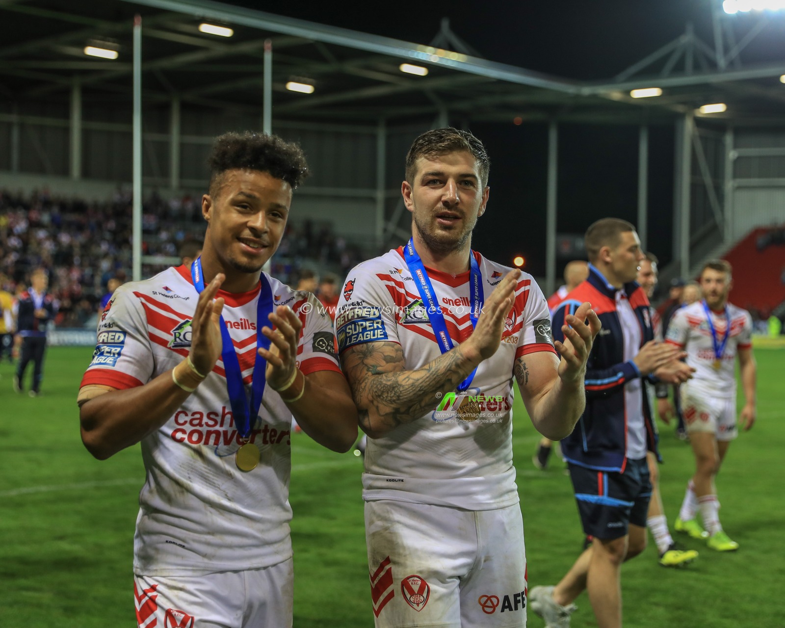 30th August 2019 , Totally Wicked Stadium, St Helens, England;  Betfred Super League Rugby, Round 27, St Helens vs Castleford Tigers ; Regan Grace (5) of St Helens and Mark Percival (4) of St Helens with their league leaders medals 

Credit: Mark Cosgrove/News Images