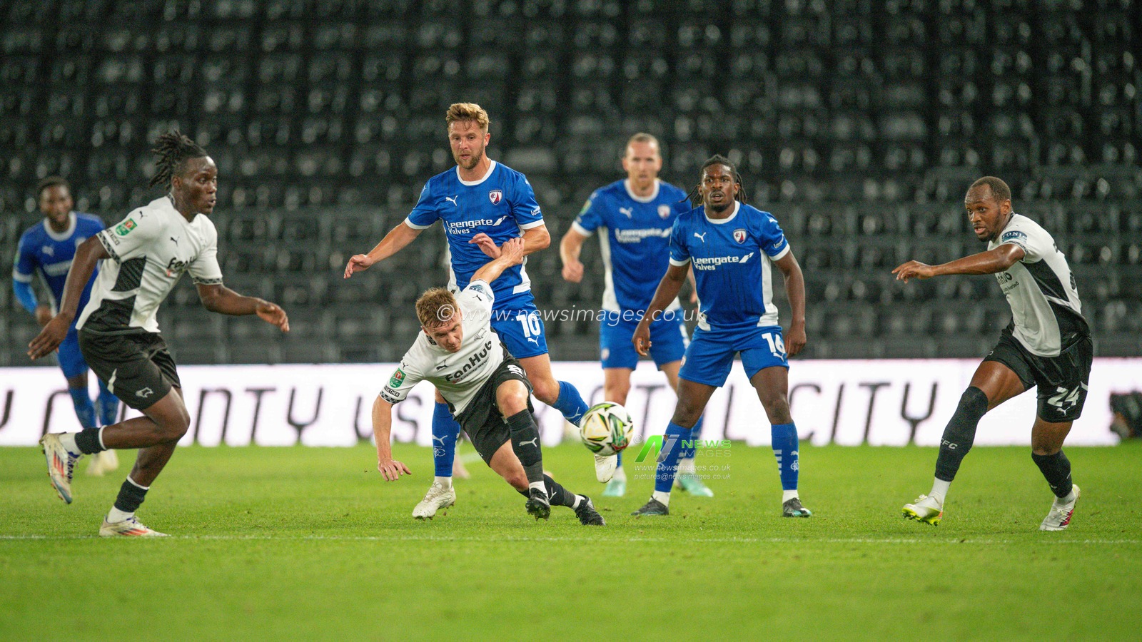 DCFC and Chesterfield players battle for the ball during the Carabao Cup match Derby County vs Chesterfield at Pride Park Stadium, Derby, United Kingdom, 13th August 2024

(Photo by Mark Dunn/News Images)
