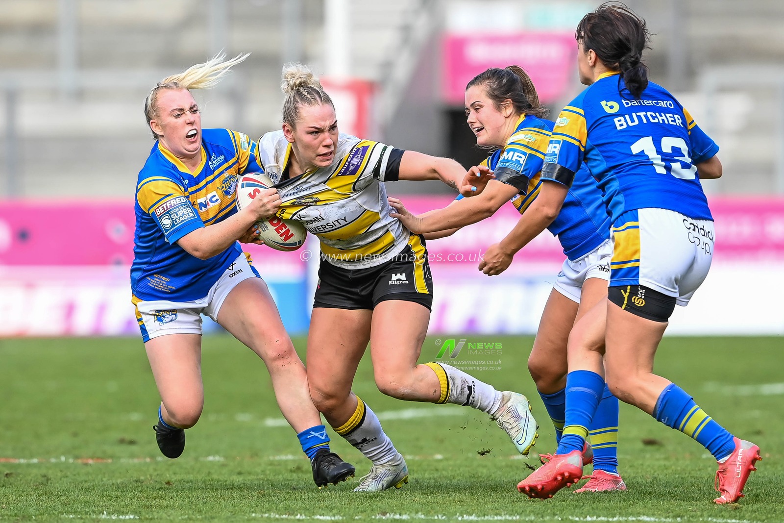 Hollie Dodd of York City Knights Women is tackled by Keara Bennett of Leeds Rhinos Women  during the Betfred Women's Super League Grand Final York CIty Knights Women vs Leeds Rhinos Women at Totally Wicked Stadium, St Helens, United Kingdom, 18th September 2022

(Photo by Craig Thomas/News Images)