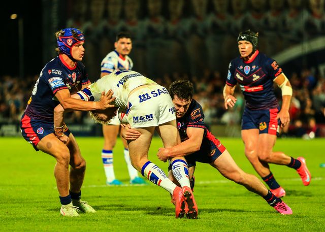 Lachlan Walmsley of Wakefield Trinity is tackled during the Betfred Super League round 21 match Wakefield Trinity vs St Helens at DIY Kitchens Stadium, Wakefield, United Kingdom, 8th August 2025

(Photo by Richard Bierton/News Images)