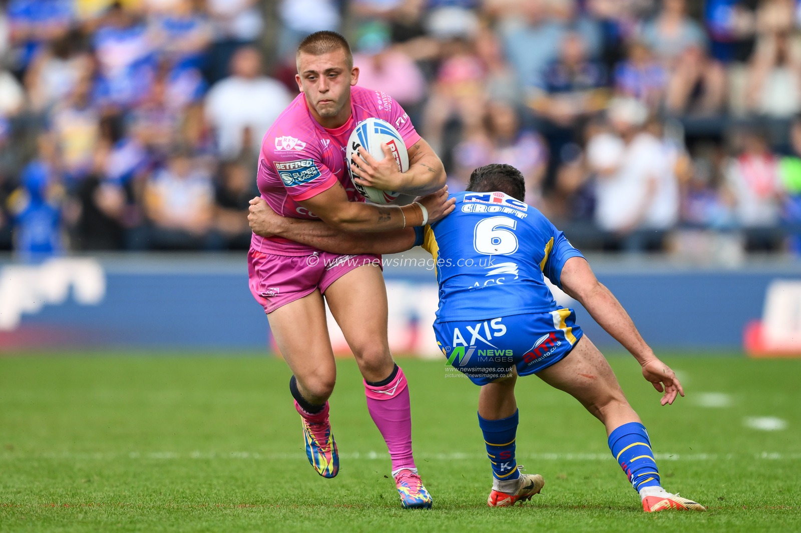 Mikey Lewis of Hull KR breaks the tackle of Brodie Croft of Leeds Rhinos during the Betfred Super League Round 18 match Leeds Rhinos vs Hull KR at Headingley Stadium, Leeds, United Kingdom, 20th July 2024

(Photo by Craig Thomas/News Images)