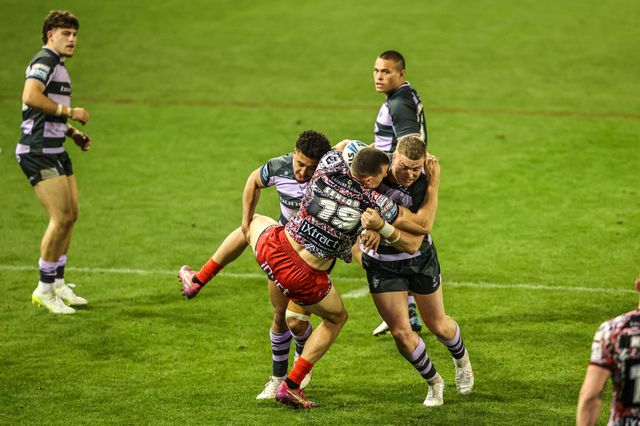 Innes Senior of Leigh Leopards is tackled by Asher O'Donnell of Huddersfield Giants during the Betfred Super League round 9 match Leigh Leopards vs Huddersfield Giants at Leigh Sports Village, Leigh, United Kingdom on 23 April 2026

(Photo by Alfie Cosgrove/News Images)