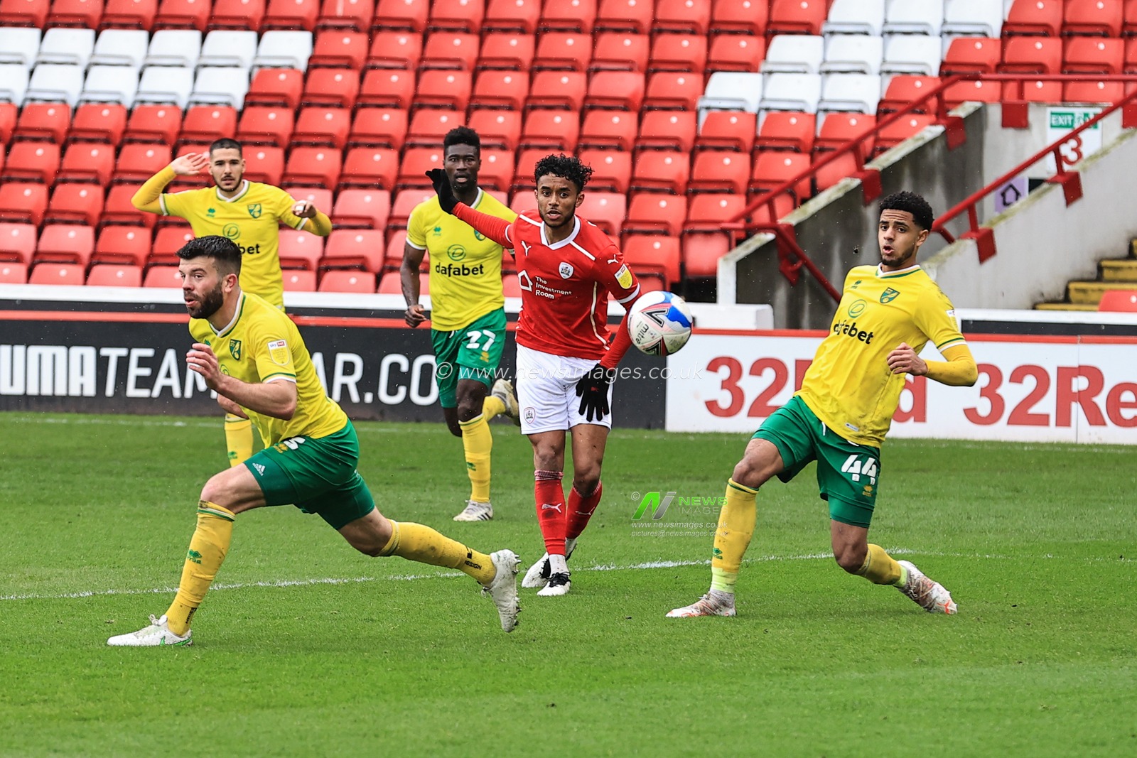 Romal Palmer #21 of Barnsley shoots Angola