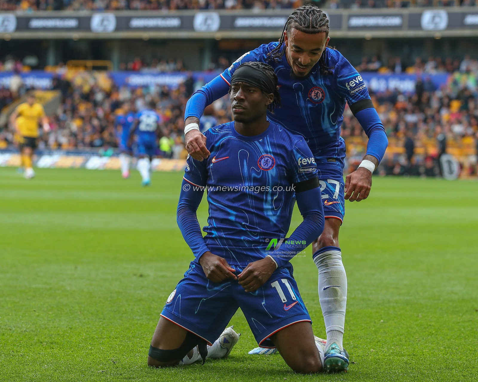 Noni Madueke of Chelsea celebrates his goal to make it 2-4 during the Premier League match Wolverhampton Wanderers vs Chelsea at Molineux, Wolverhampton, United Kingdom, 25th August 2024

(Photo by Gareth Evans/News Images)