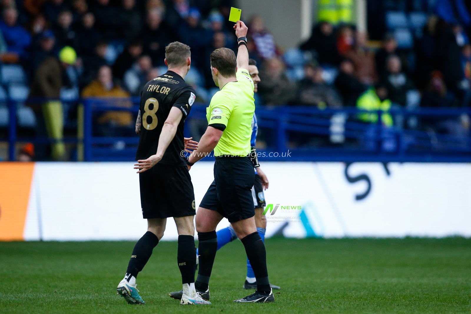 The referee issues a yellow card to Lee Gregory #9 of Sheffield Wednesday during the Sky Bet League 1 match Sheffield Wednesday vs Peterborough at Hillsborough, Sheffield, United Kingdom, 4th March 2023

(Photo by Ben Early/News Images)