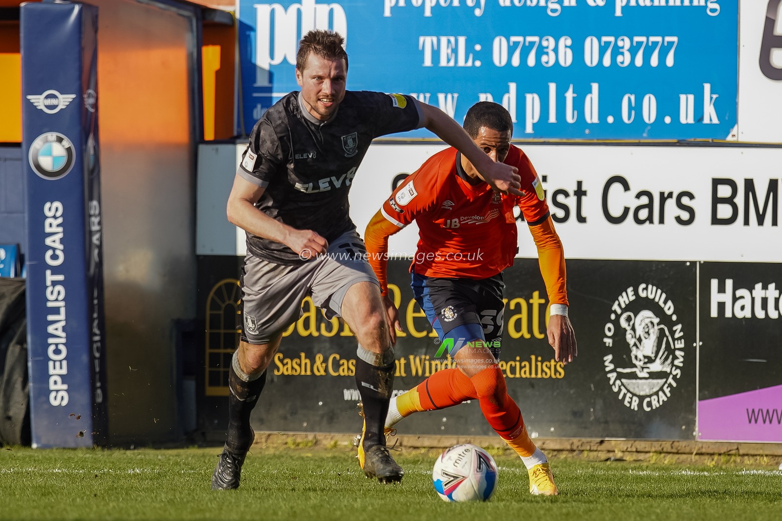 Julian Borner #13 of Sheffield Wednesday battles Tom Ince #39 of Luton Town