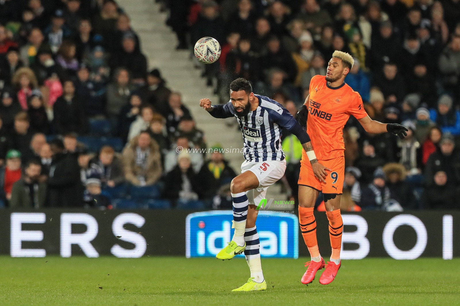3rd March 2020, The Hawthorns, West Bromwich, England; Emirates FA Cup 5th Round, West Bromwich Albion v Newcastle United : Kyle Bartley (5) of West Bromwich Albion heads the ball clears of Joelinton (9) of Newcastle United