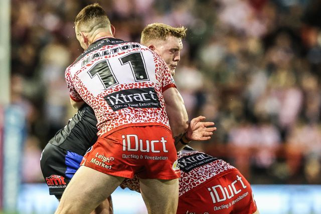 James McDonnell of Leeds Rhinos is tackled during the Betfred Super League round 21 match Leigh Leopards vs Leeds Rhinos at Leigh Sports Village, Leigh, United Kingdom, 7th August 2025

(Photo by Alfie Cosgrove/News Images)
