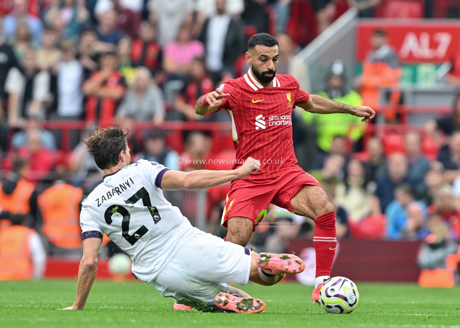 Illya Zabarnyi of Bournemouth tackles Mohamed Salah of Liverpool during the Premier League match Liverpool vs Bournemouth at Anfield, Liverpool, United Kingdom, 21st September 2024

(Photo by Cody Froggatt/News Images)