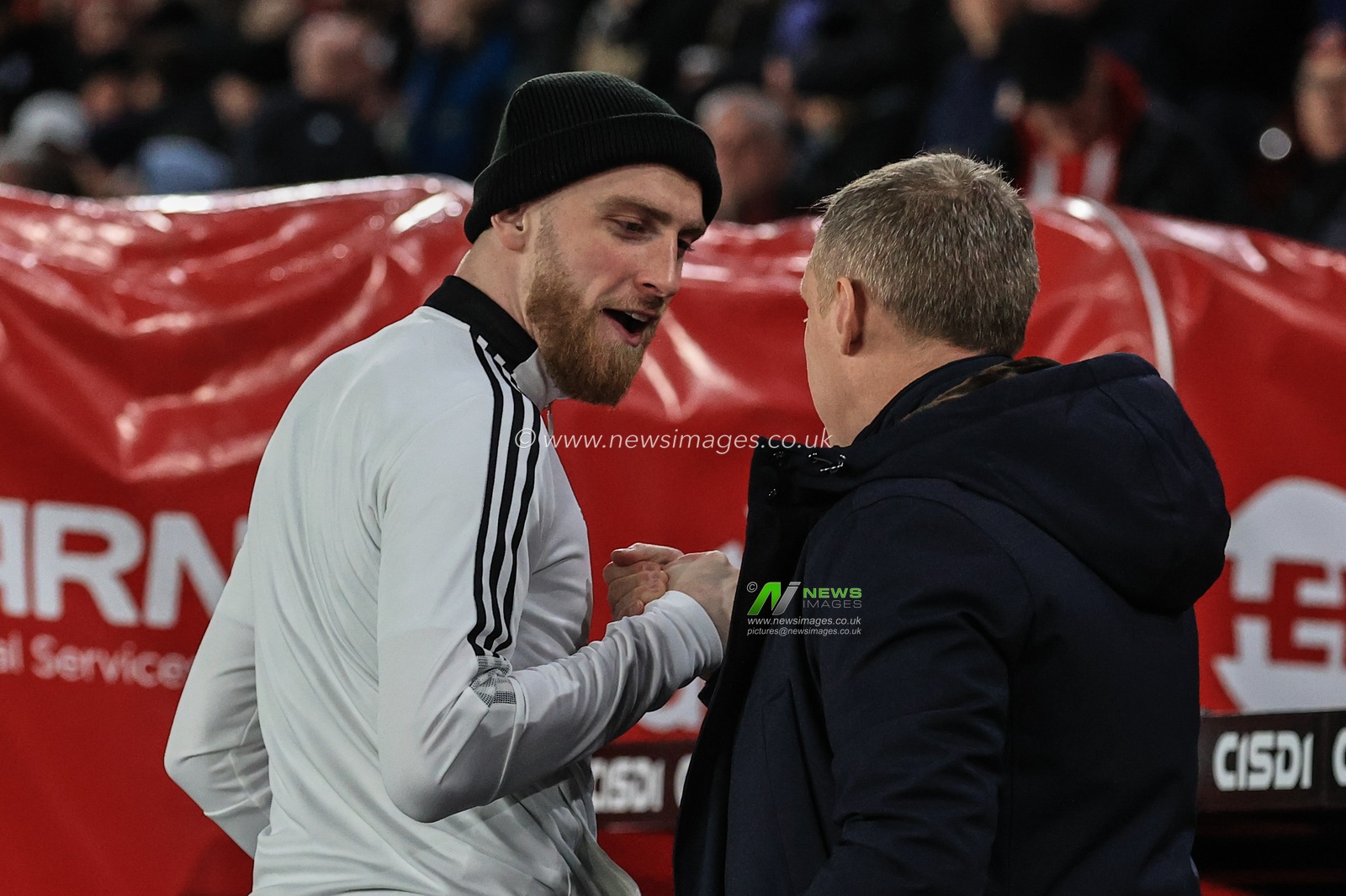 Oliver McBurnie #9 of Sheffield United embraces his old gaffer, Steve Cooper manager of Nottingham Forest formerly of Swansea City