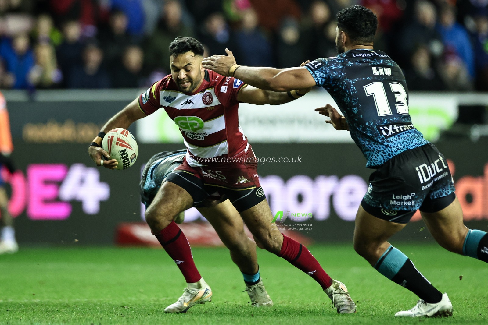 Bevan French of Wigan Warriors evades Isaac Liu of Leigh Leopards during the Betfred Super League Round 1 match Wigan Warriors vs Leigh Leopards at The Brick Community Stadium, Wigan, United Kingdom, 13th February 2025

(Photo by Mark Cosgrove/News Images)