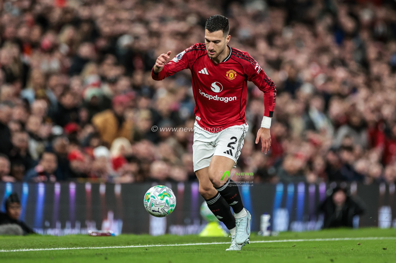 Diogo Dalot of Manchester United breaks with the ball during the Premier League match Manchester United vs Leeds United at Old Trafford, Manchester, United Kingdom on 13 April 2026

(Photo by Mark Cosgrove/News Images)