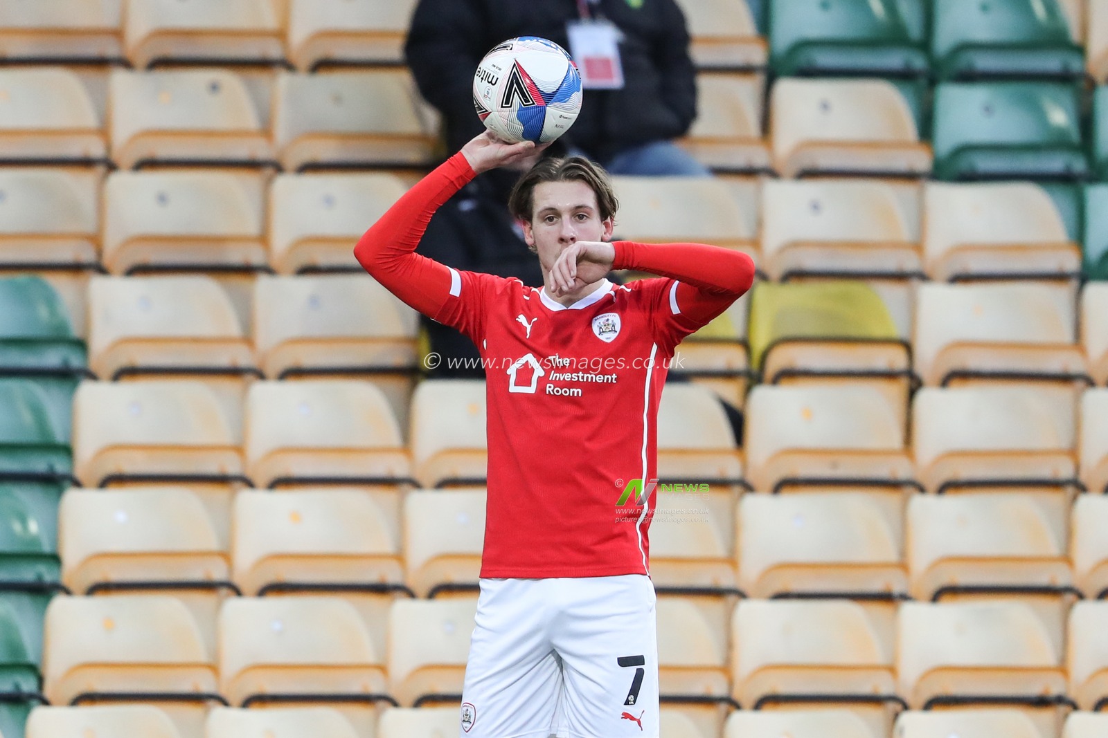 Callum Brittain #7 of Barnsley takes a throw-in