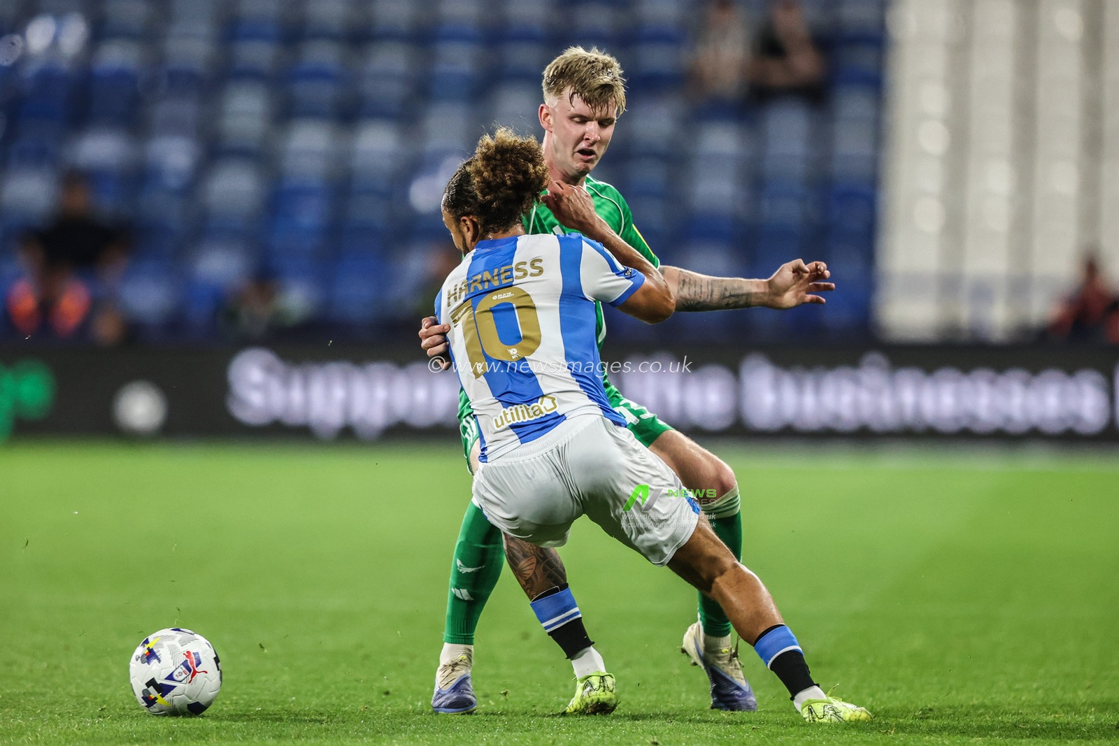 Charlie McArthur of Newcastle United and Marcus Harness of Huddersfield Town battle for the ball during the The Vertu Trophy match Huddersfield Town vs Newcastle United U21 at Accu Stadium, Huddersfield, United Kingdom, 2nd September 2025

(Photo by Alfie Cosgrove/News Images)
