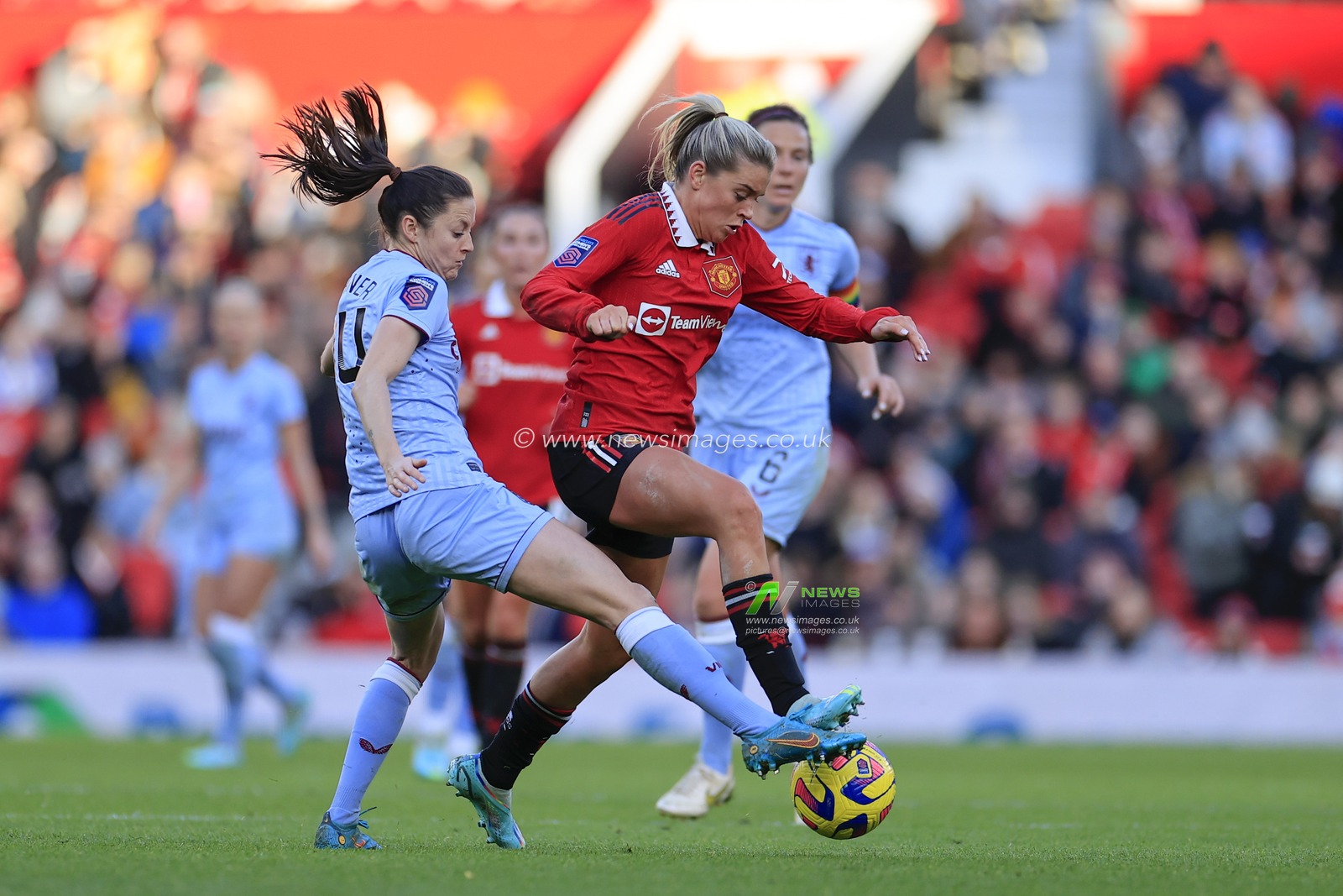 Alessia Russo #23 of Manchester United and Danielle Turner #14 of Aston Villa challenge for the ball during The FA Women's Super League match Manchester United Women vs Aston Villa Women at Old Trafford, Manchester, United Kingdom, 3rd December 2022

(Photo by Conor Molloy/News Images)
