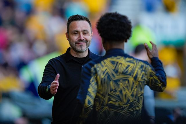 Roberto De Zerbi manager of Tottenham Hotspur smiles and greets former player Angel Gomes of Wolverhampton Wanderers during the Premier League match Wolverhampton Wanderers vs Tottenham Hotspur at Molineux, Wolverhampton, United Kingdom on 25 April 2026

(Photo by Maynard Manyowa/News Images)