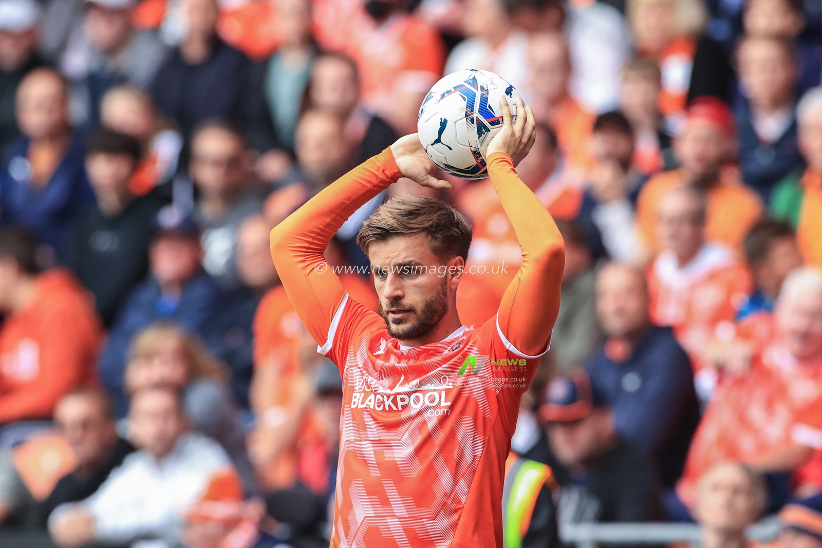 Luke Garbutt #29 of Blackpool takes a throw-in