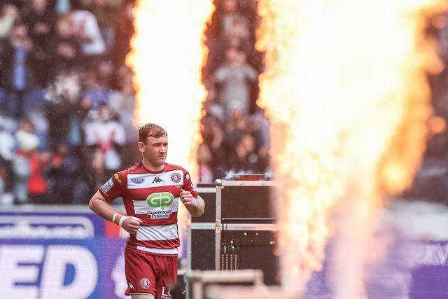 Harry Smith of Wigan Warriors walks out to a burst of flames during the Betfred Super League Round 8 match Wigan Warriors vs St Helens at The Brick Community Stadium, Wigan, United Kingdom, 18th April 2025

(Photo by Mark Cosgrove/News Images)