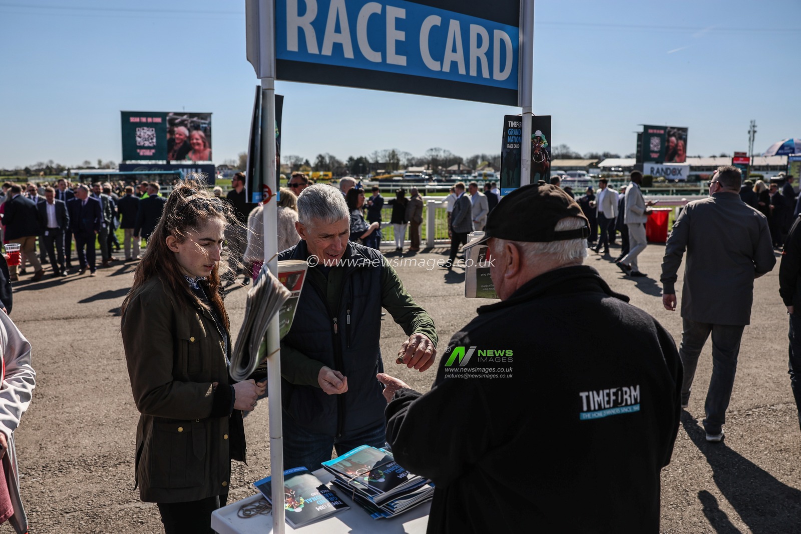Racegoers buy race cards during the Randox Grand National 2025 Day 3 Grand National Day at Aintree Racecourse, Liverpool, United Kingdom, 5th April 2025

(Photo by Mark Cosgrove/News Images)