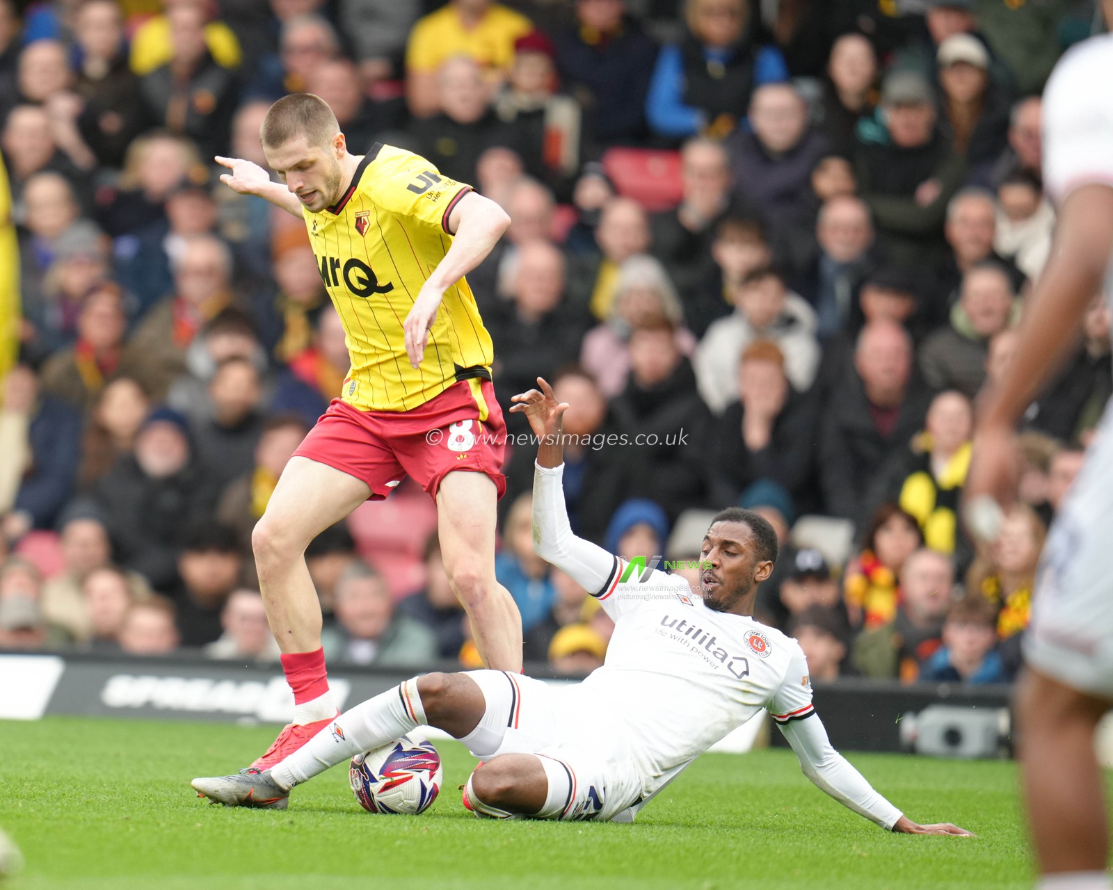 Isaiah Jones of Luton Town slide tackles Giorgi Chakvetadze of Watford during the Sky Bet Championship match Watford vs Luton Town at Vicarage Road, Watford, United Kingdom, 23rd February 2025

(Photo by Harvey Murphy/News Images)