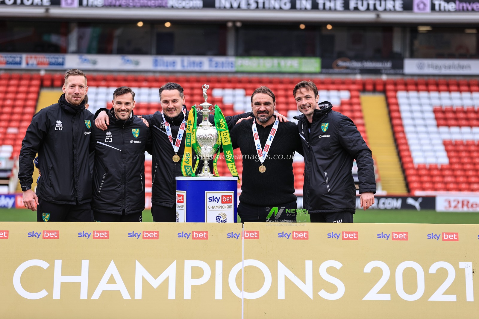 Daniel Farke manager of Norwich City and his staff with the Championship trophy after Norwich win the Championship and head to the Premier League