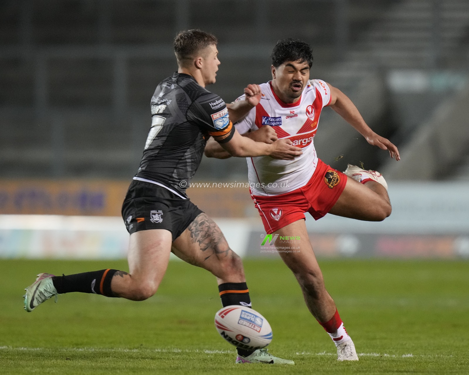James Bell of St. Helens fumbles the ball during the Betfred Super League  Round 8 match St Helens vs Hull FC at Totally Wicked Stadium, St Helens, United Kingdom, 19th April 2024

(Photo by Steve Flynn/News Images)