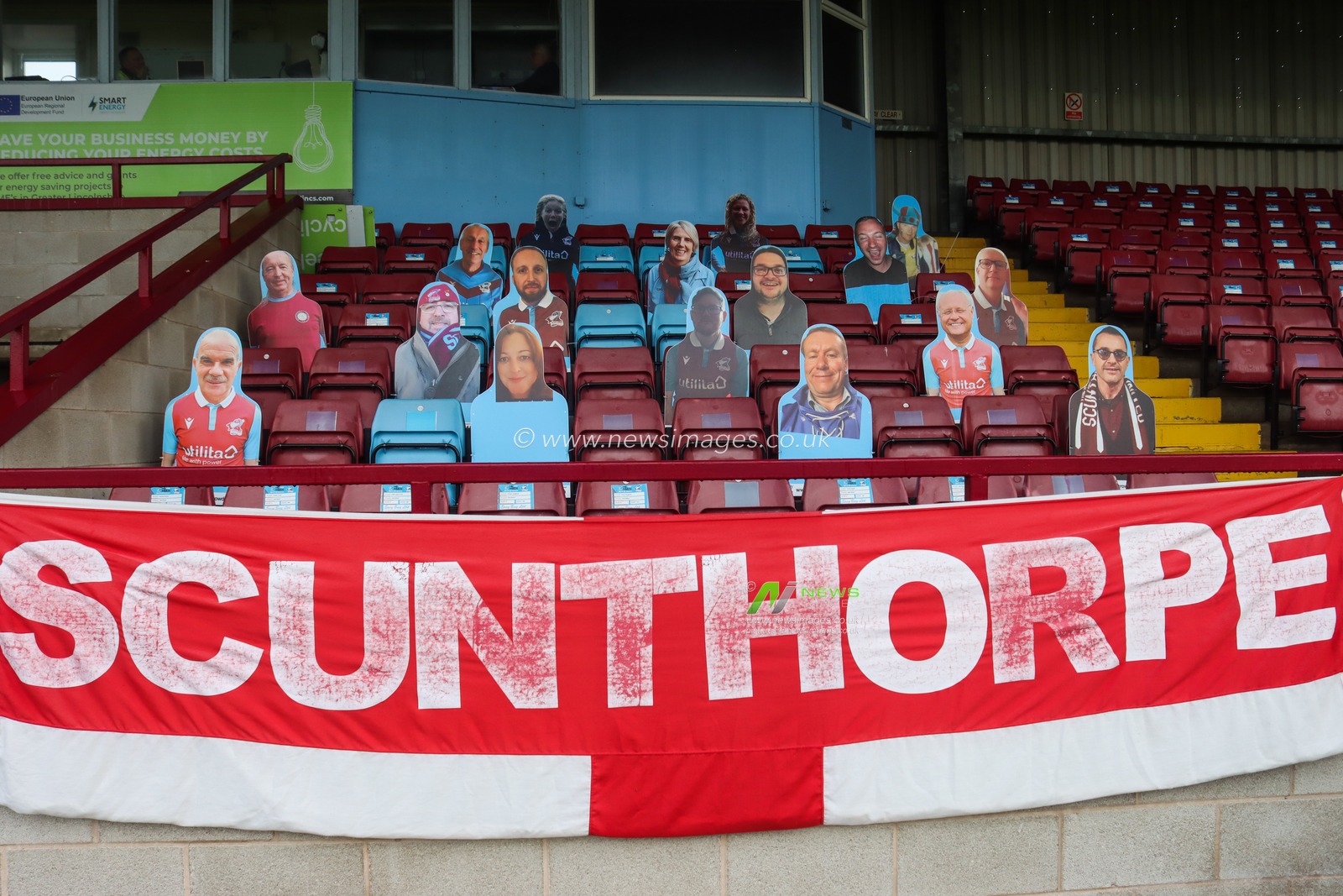 Cardboard cutouts of fans are seen in the stands at Glanford Park