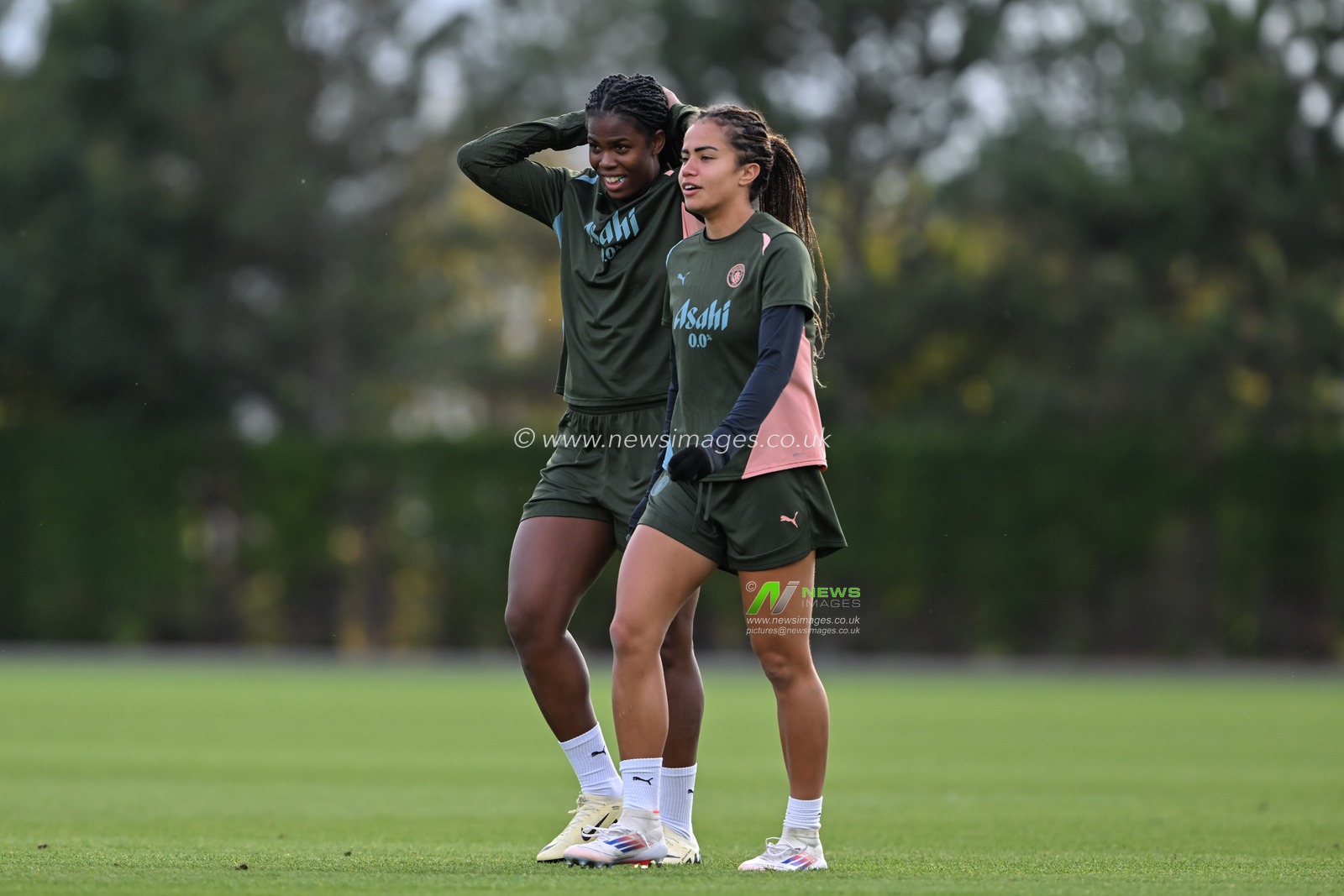 Khadija Shaw of Manchester City Women walks with Mary Fowler of Manchester City Women during Manchester City Women Champions league open training session at Joie Stadium, Manchester, United Kingdom, 8th October 2024

(Photo by Cody Froggatt/News Images)