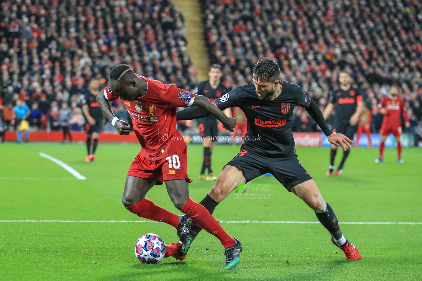 11th March 2020, Anfield, Liverpool, England; UEFA Champions League, Round of 16 Leg 2 of 2, Liverpool v Atletico Madrid : Sadio Mane (10) of Liverpool holds off SaÃºl (8) of Atletico Madrid
