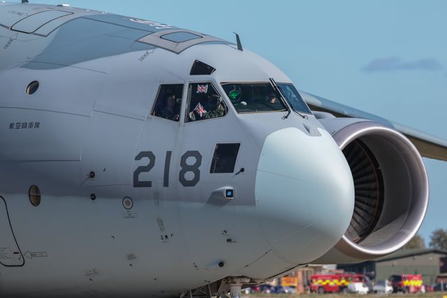 A pilot waves a Union Jack Flag as a Kawasaki C-2 transporter leaves.  The Japan Air Self-Defense Force (JASDF) has successfully competes the first fighter aircraft deployment to Europe in its 71-year history, as they join the United Kingdomâ€™s Royal Air Force as they arrive at RAF Coningsby as part of the "Atlantic Eagles" mission. This landmark achievement strengthens defence cooperation between the United Kingdom and Japan whilst demonstrating the interconnected nature of global security at RAF Coningsby, Coningsby, United Kingdom, 22nd September 2025

(Photo by Mark Cosgrove/News Images)