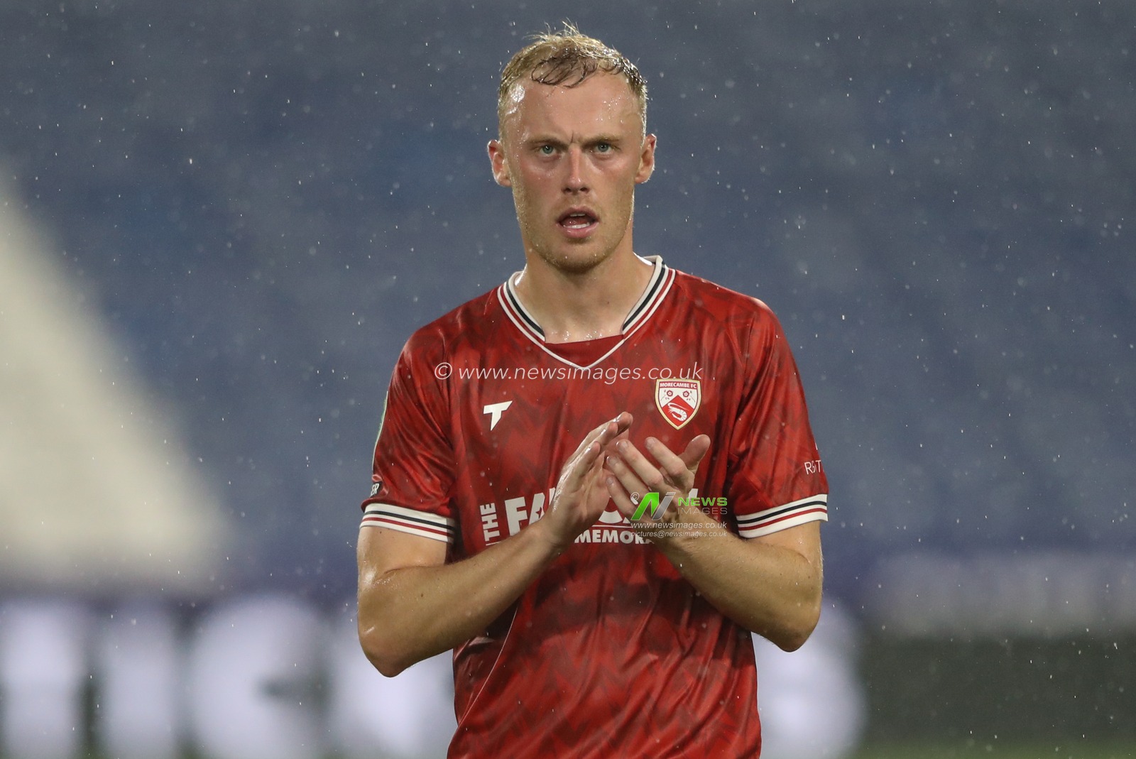 Ross Millen of Morecambe applauds the travelling fans after the game during the Carabao Cup match Huddersfield Town vs Morecambe at John Smith's Stadium, Huddersfield, United Kingdom, 13th August 2024

(Photo by Alfie Cosgrove/News Images)