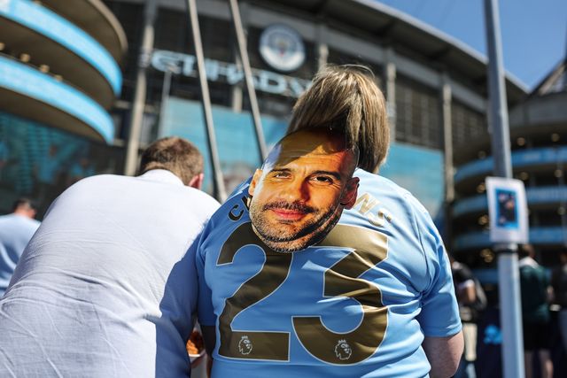 A Man City dan with a Pep Guardiola manager of Manchester City face mask during the Premier League match Manchester City vs Aston Villa at Etihad Stadium, Manchester, United Kingdom on 24 May 2026

(Photo by Mark Cosgrove/News Images)